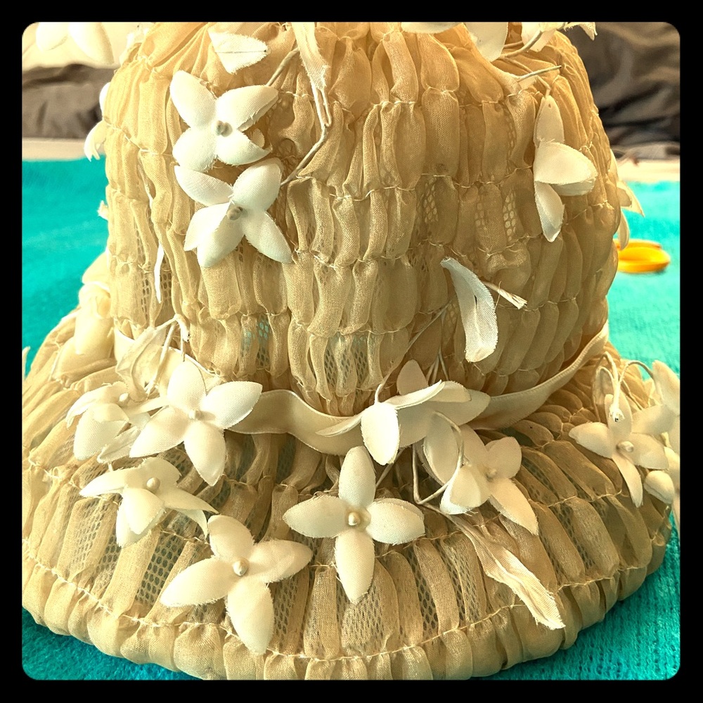 Vintage hat with wired flowers.